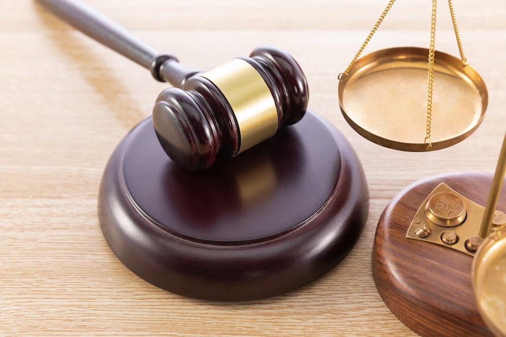 A gavel next to a scale