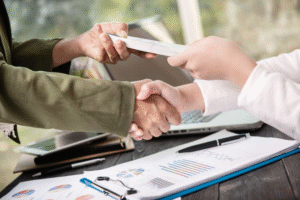 Two people exchanging cash