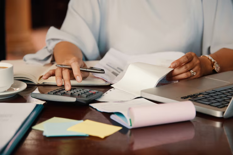 A person using a calculator