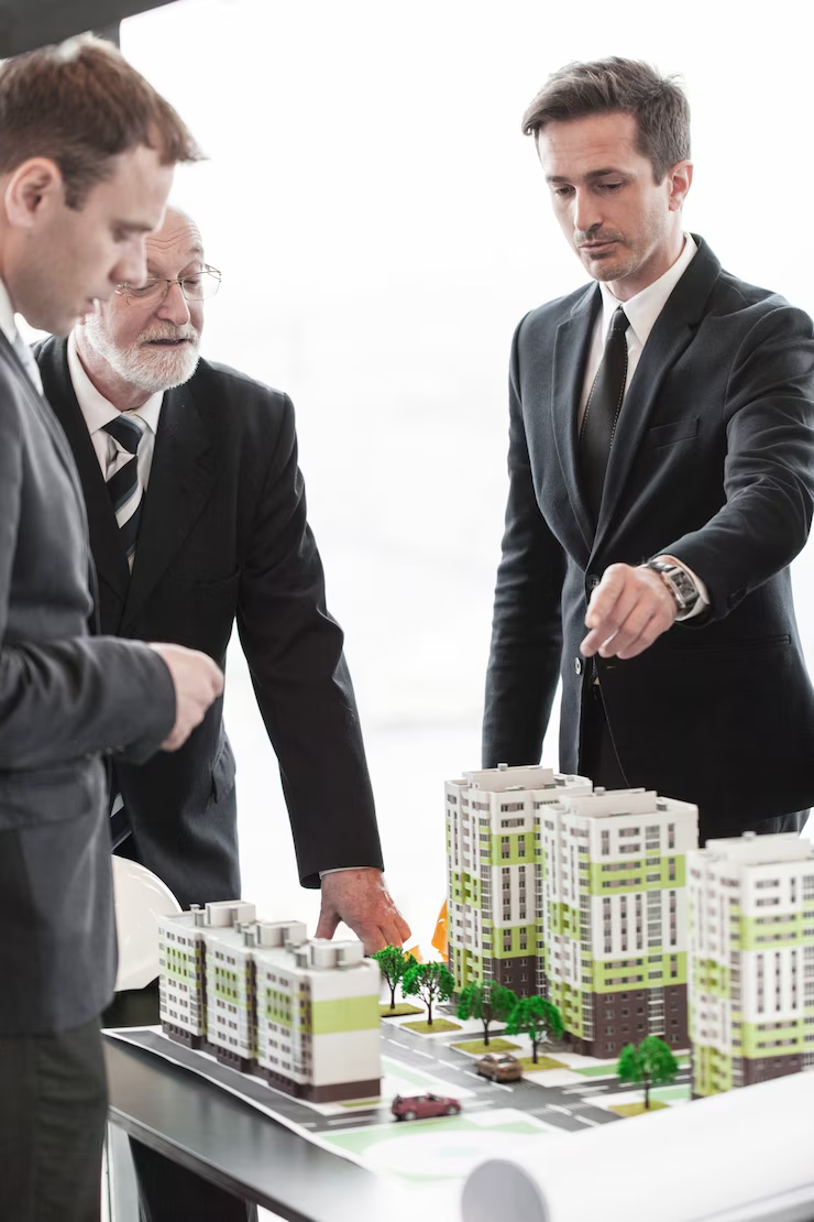 People discussing a model building