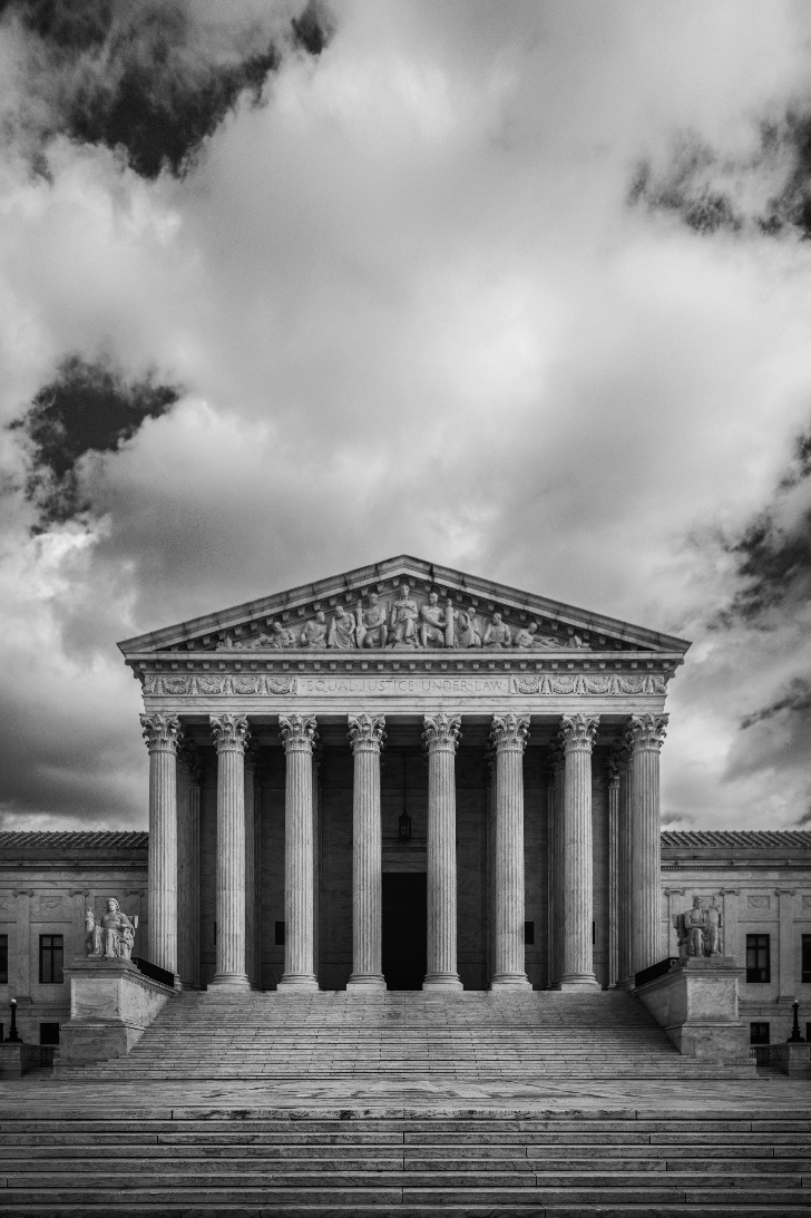 A black and white photo of the U.S. supreme court