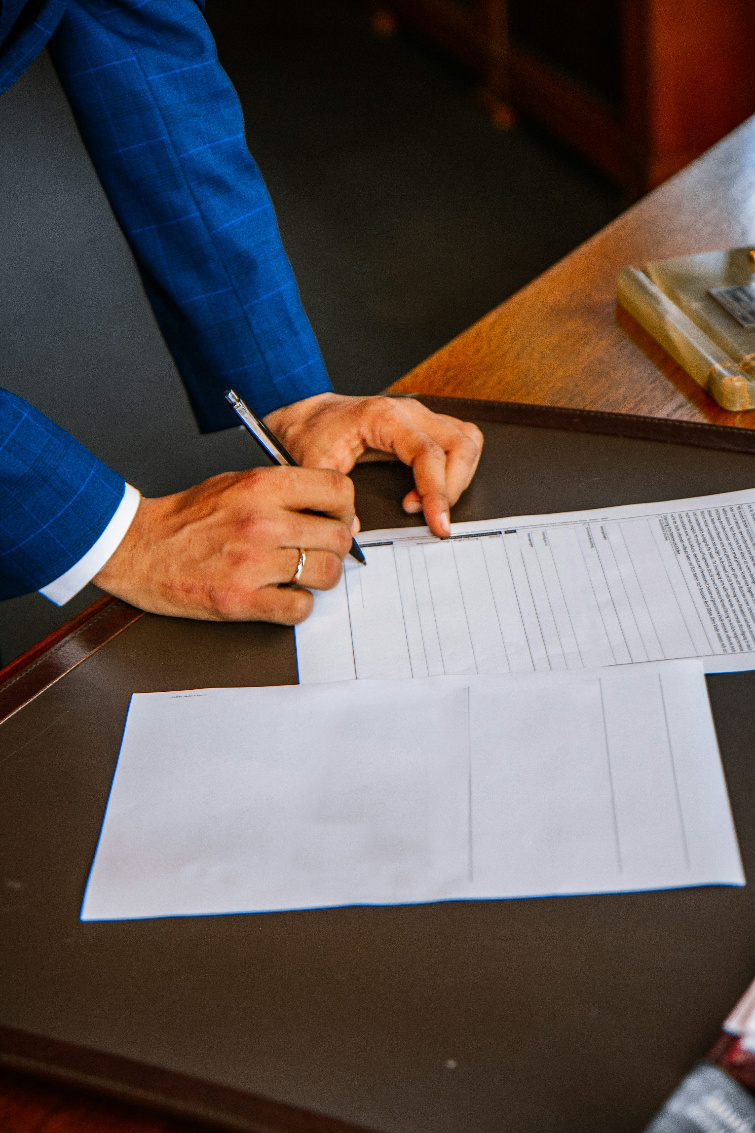 A man signing a paper