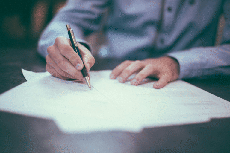 A man writing on documents