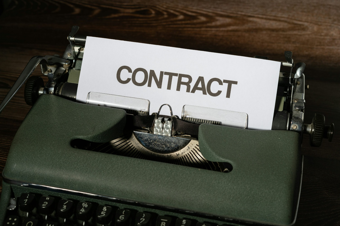 A paper with ‘contract’ written on it
