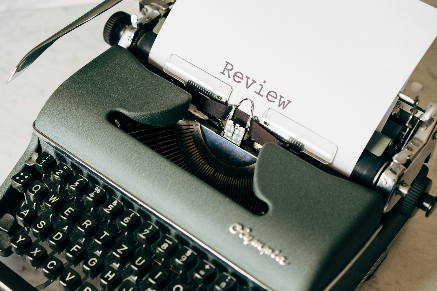 The word ‘review’ written with a typewriter