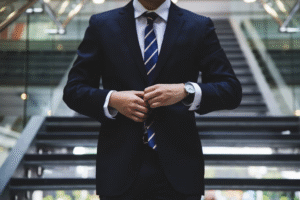 a man buttoning his suit