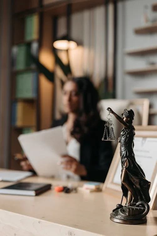 Lady Justice statue on a law office desk.