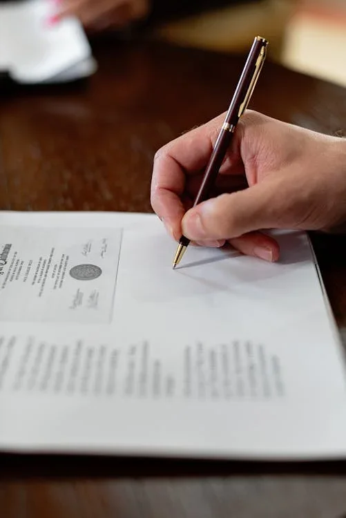a person signing a document
