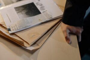 A newspaper clipping and documents