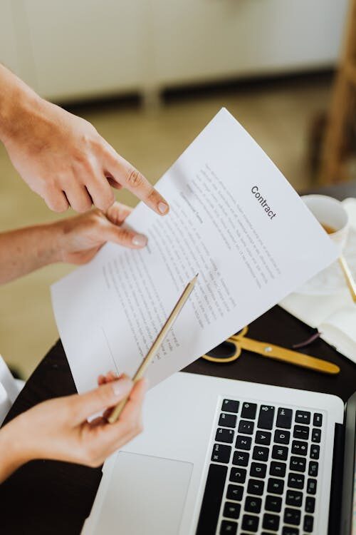 Hands holding a contract paper
