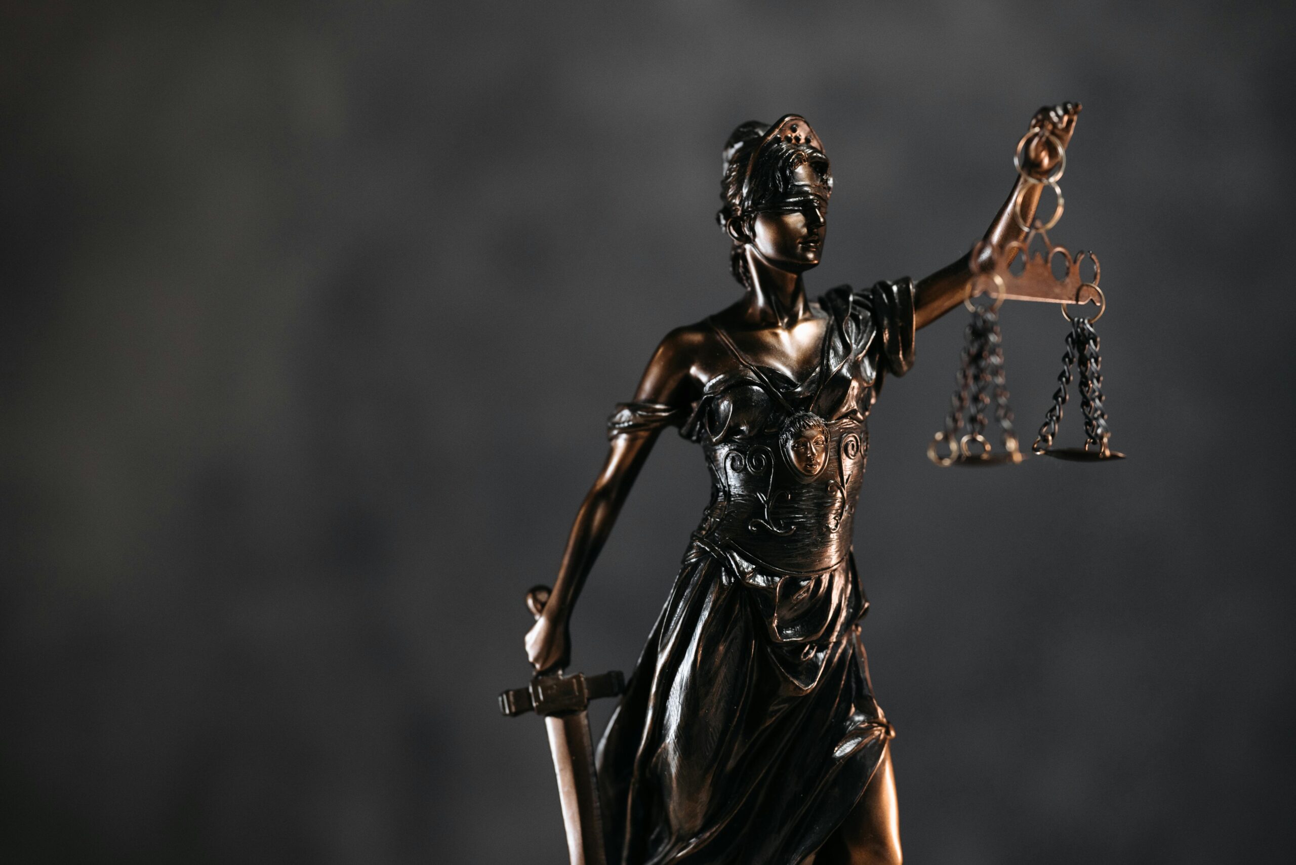 A sculpture holding a balance scale