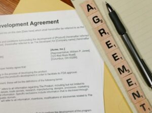 This photo shows a document beside a pen.