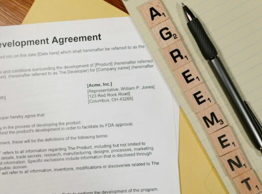 This photo shows a document beside a pen.