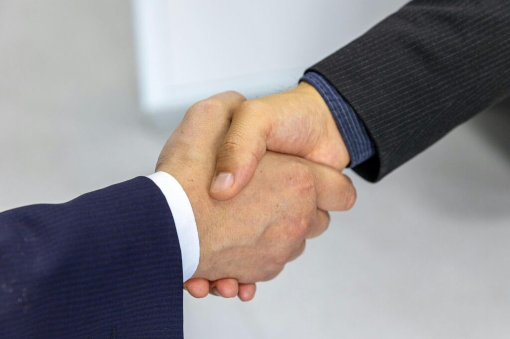 Two people doing a handshake