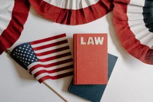 A law book next to an American flag