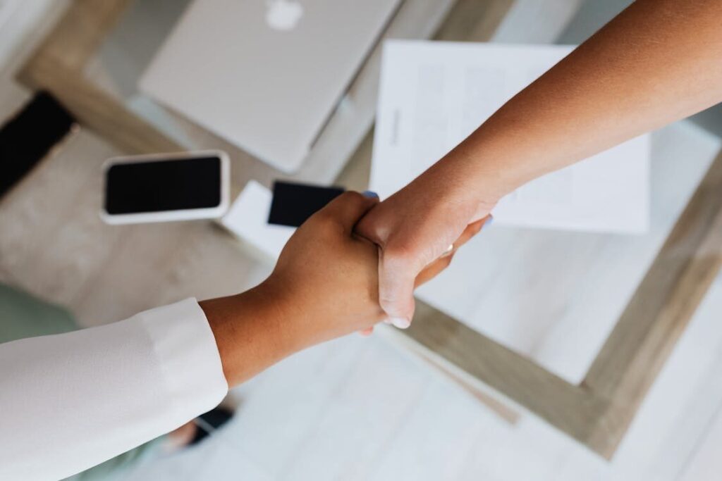 Two people shaking their hands