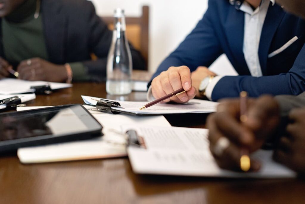 A group of people reviewing papers on a table