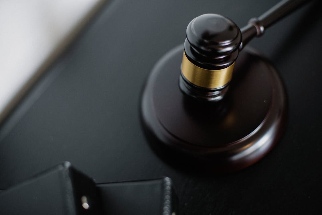 A gavel next to files