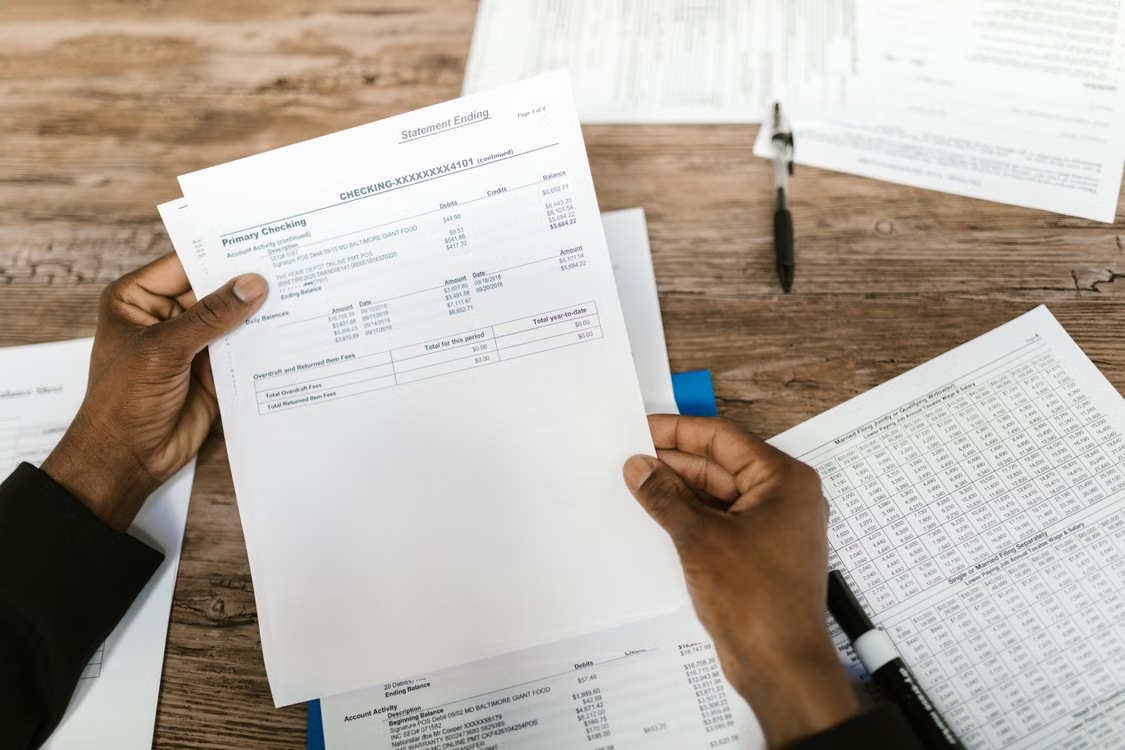 A person holding a financial statement