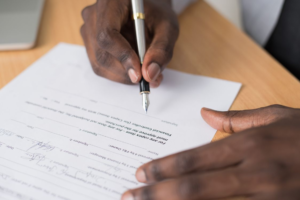 A person writing on a paper