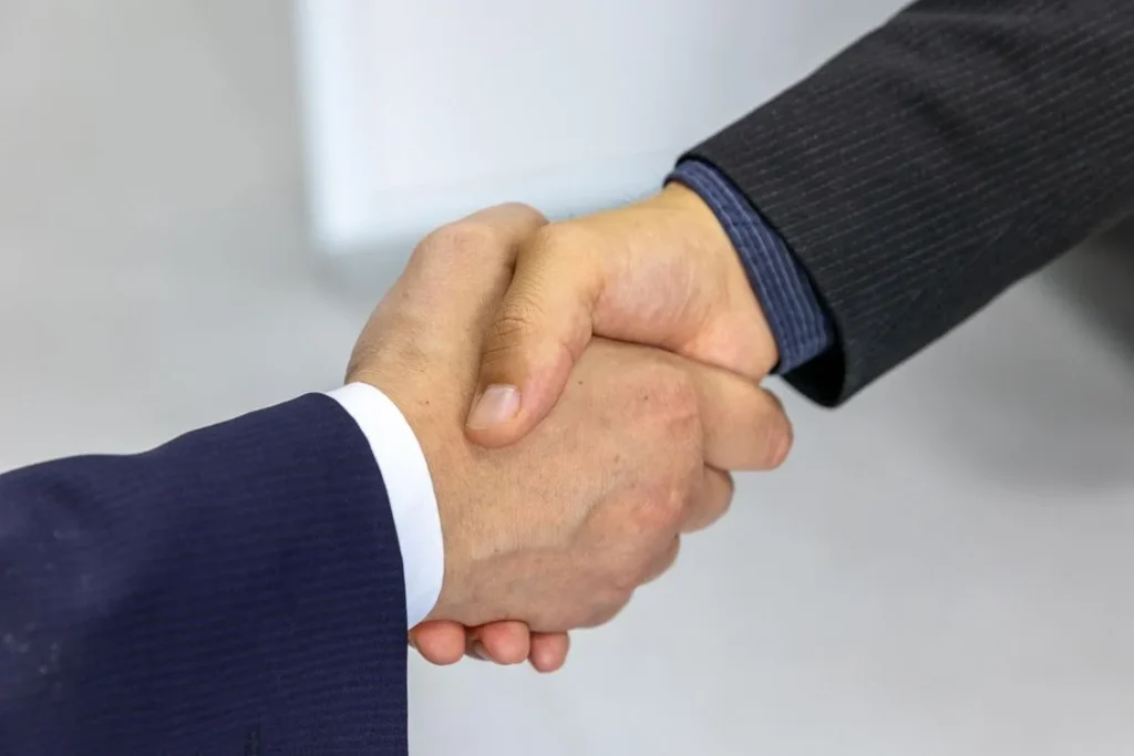 Two people shaking hands