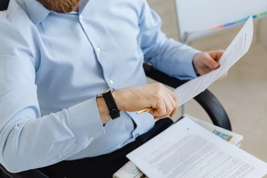 A person reading a paper