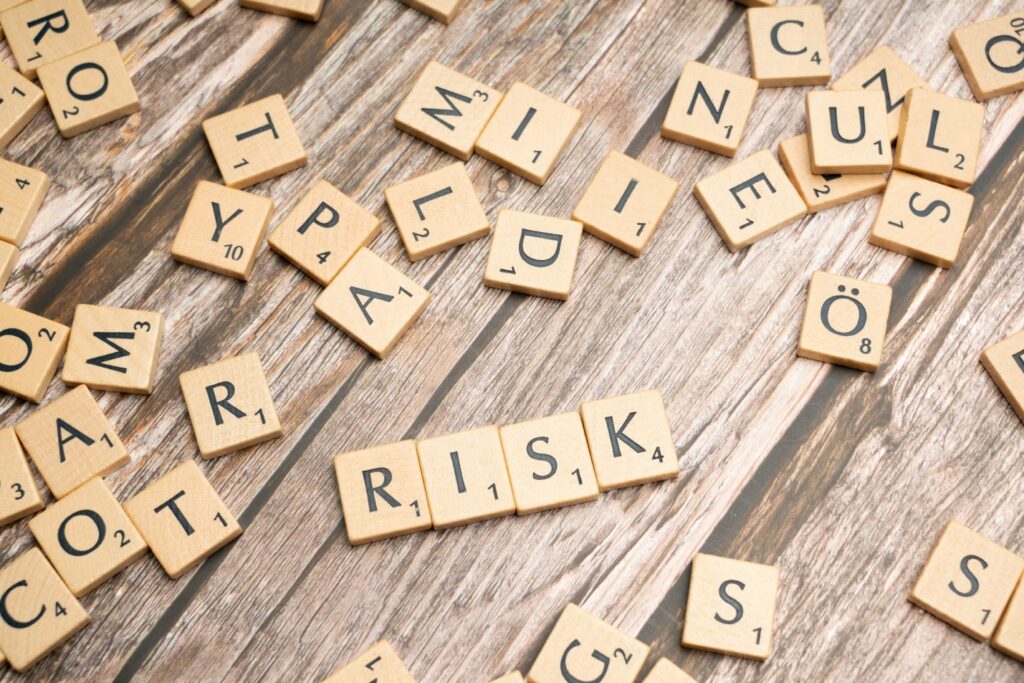 Scrabble tiles spelling out words Risk